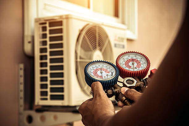 Professional Air Conditioning Service technician working in Bogart, GA